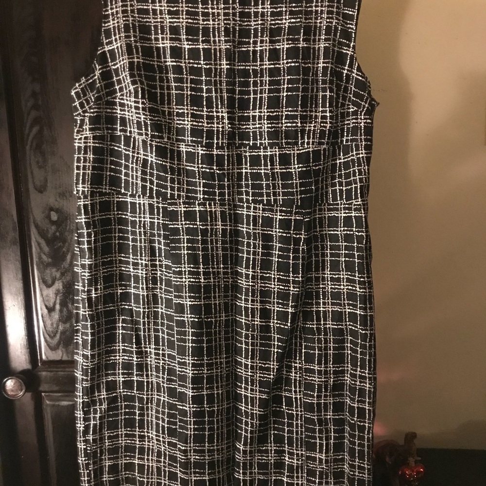 Sleeveless dress with waist detail.